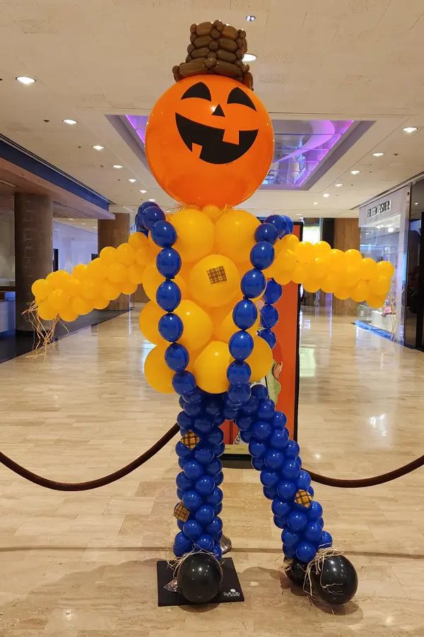 Balloon sculpture of a scarecrow standing 10ft tall