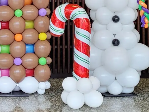 Decorative candy cane balloon on a base