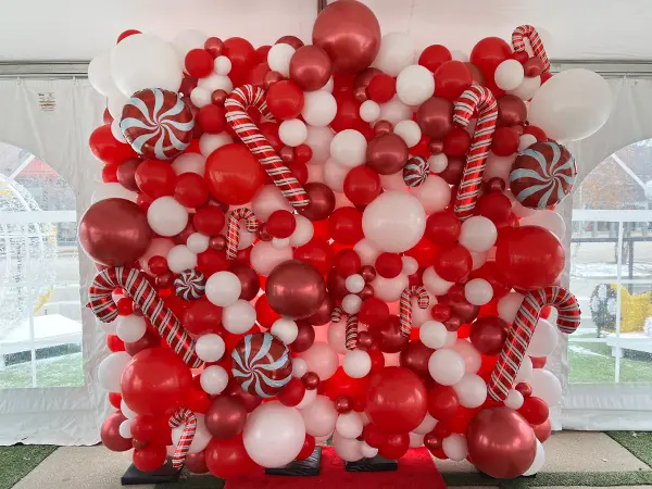 8ftx8ft Organic balloon wall with candy cane foil balloon accents