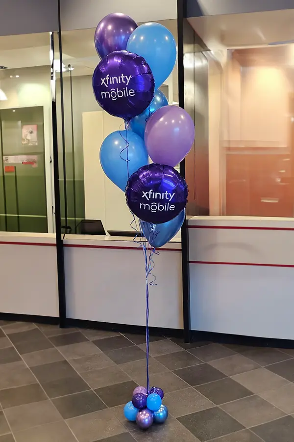 Pedestal balloon centerpiece with oil balloon numbers on top