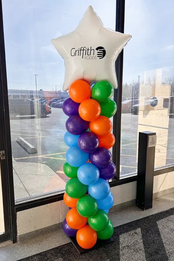 7.5ft tall classic balloon column with logo on foil shape topper