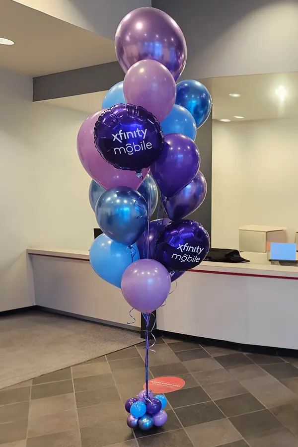 Pedestal balloon centerpiece with oil balloon numbers on top