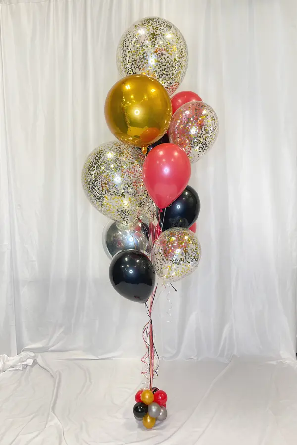 A sparkling balloon bouquet with a mix of balloon sizes and glitter balloons