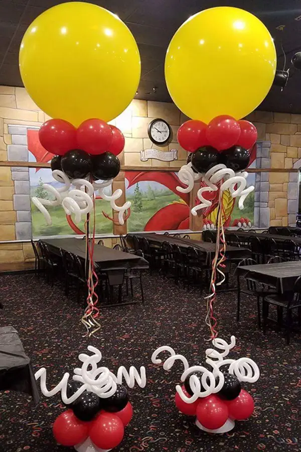 Jumbo balloon topped helium balloon column