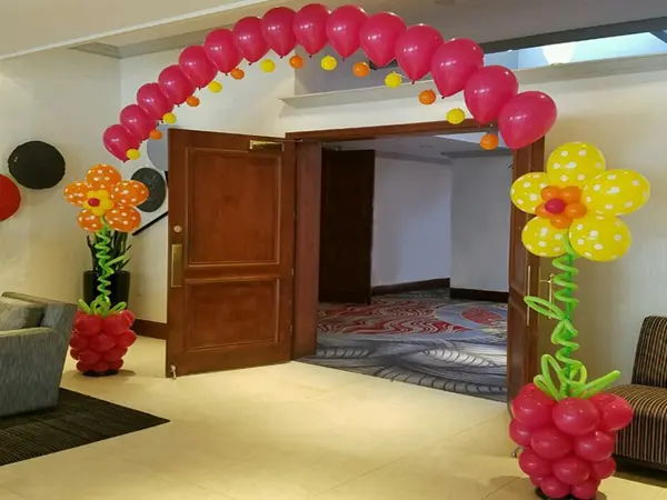 Indoor balloon arch with flowerpot balloon displays