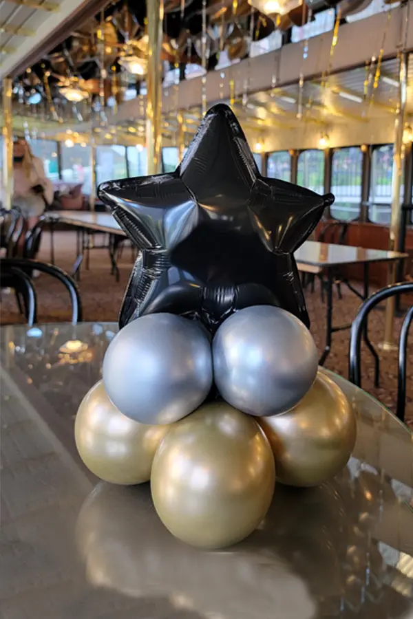 Small table centerpieces with foil star topper
