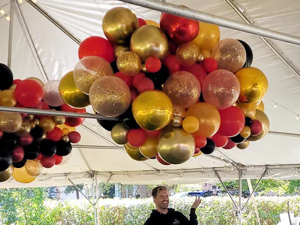 Decorate the roof of your party tent or add some color and sparkle to the ceiling of large venues with cloud like balloon decor