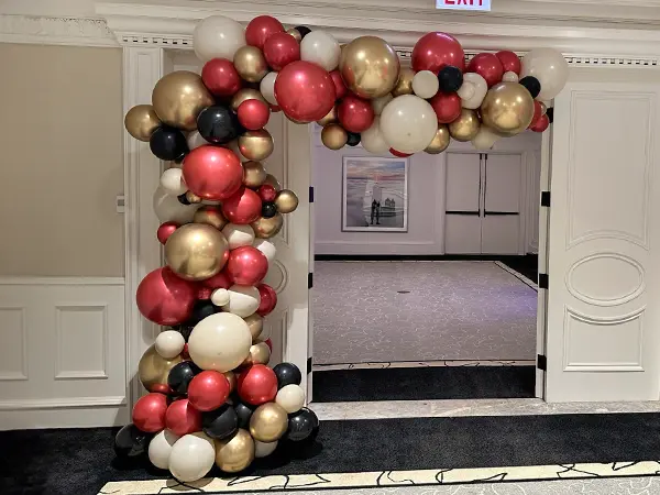 A freestanding organic balloon wave is a fashionable alternative to the classic look of balloon arch