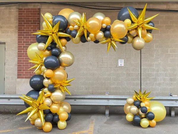 Creating a new look on balloon arches with foil starburst accents