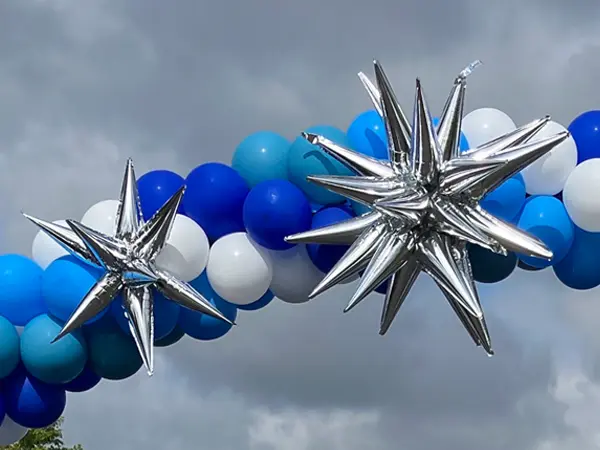 Small and large foil starbursts added to a classic arch