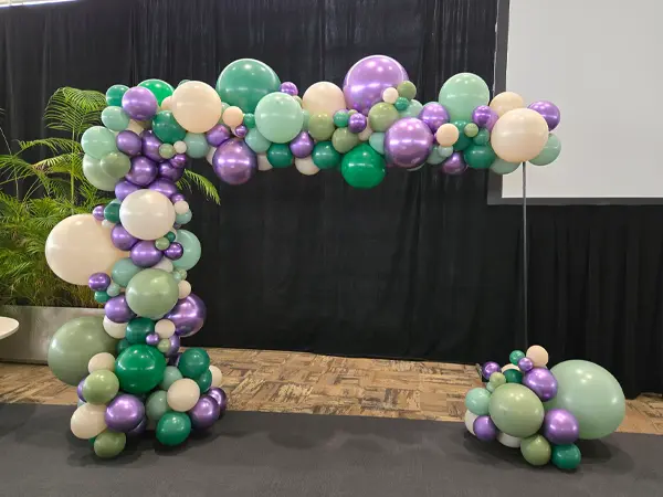 A 8ftx10ft wide trendy style balloon arch for corporate event photo ops