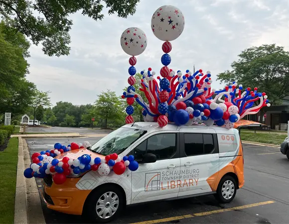 Decorate your parade vehicle with balloons to grab attention from the crowd