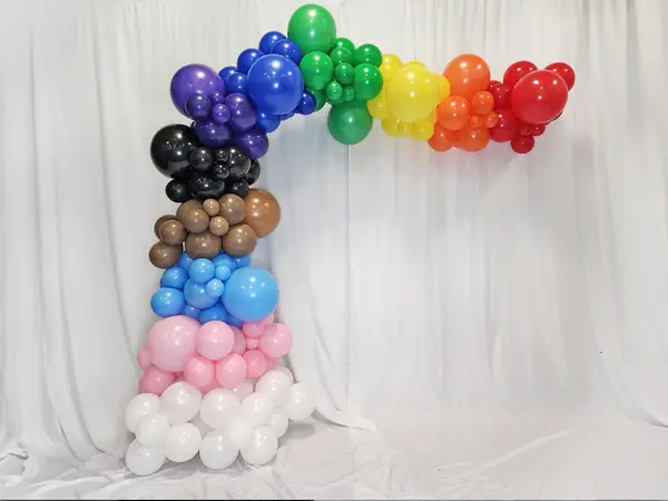 18in balloon on top of a squiggle creating a whimsical balloon centerpiece