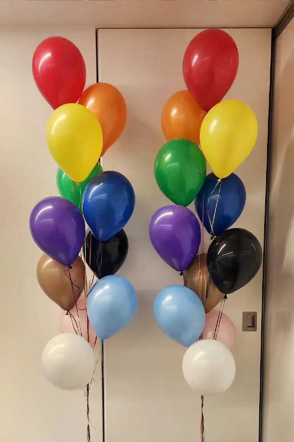 Classic balloon bouquet with 11 balloons in pride rainbow colors