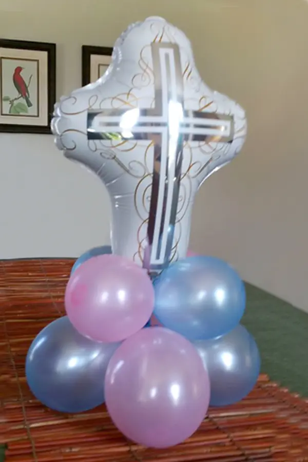 Mini balloon centerpiece with foil cross balloon