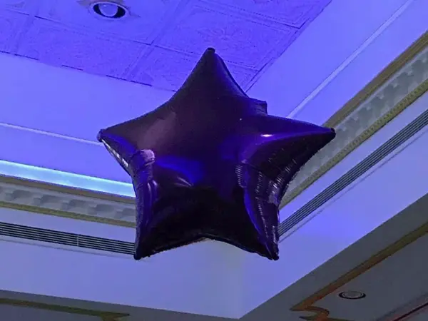Large foil star hung form the ceiling