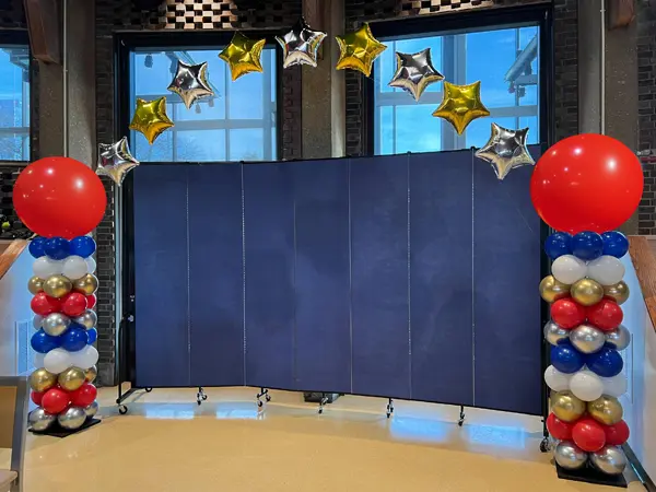 Columns with glitter toppers and helium star arch