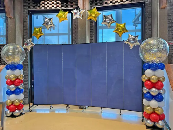 Columns with glitter toppers and helium star arch