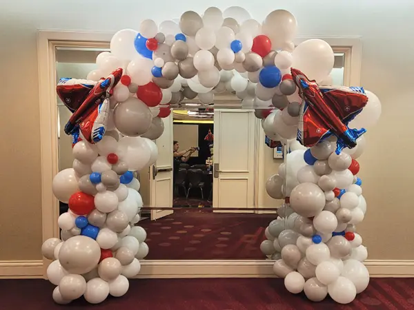Organic balloon arch with large foil shapes