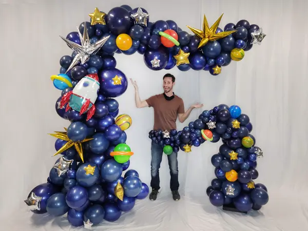 Space themed balloon waves with Tommy for scale