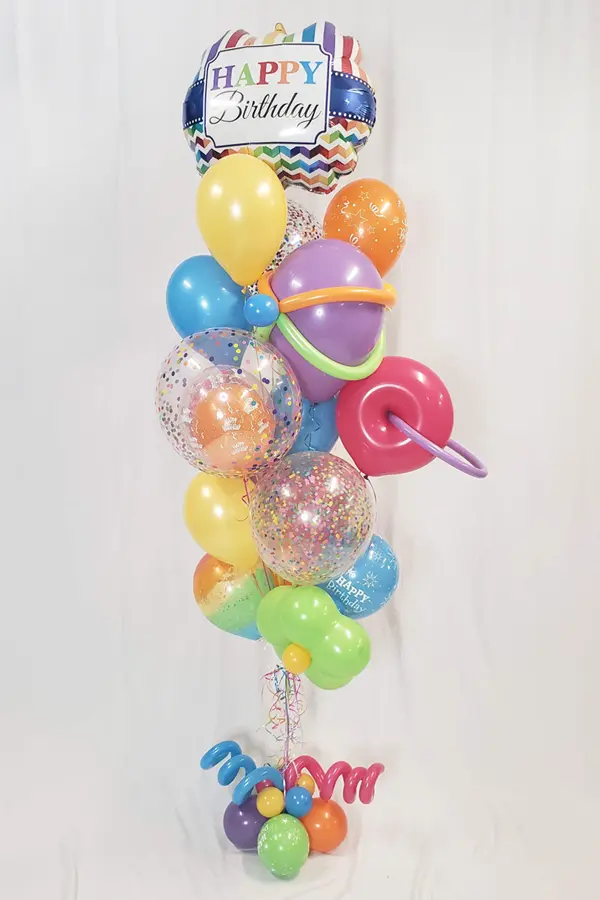 A whimsical balloon bouquet with multiple balloon types and styles to match your favorite colors or party theme