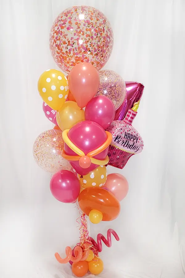 A large whimsical balloon bouquet with multiple balloon types and styles to match your favorite colors or party theme