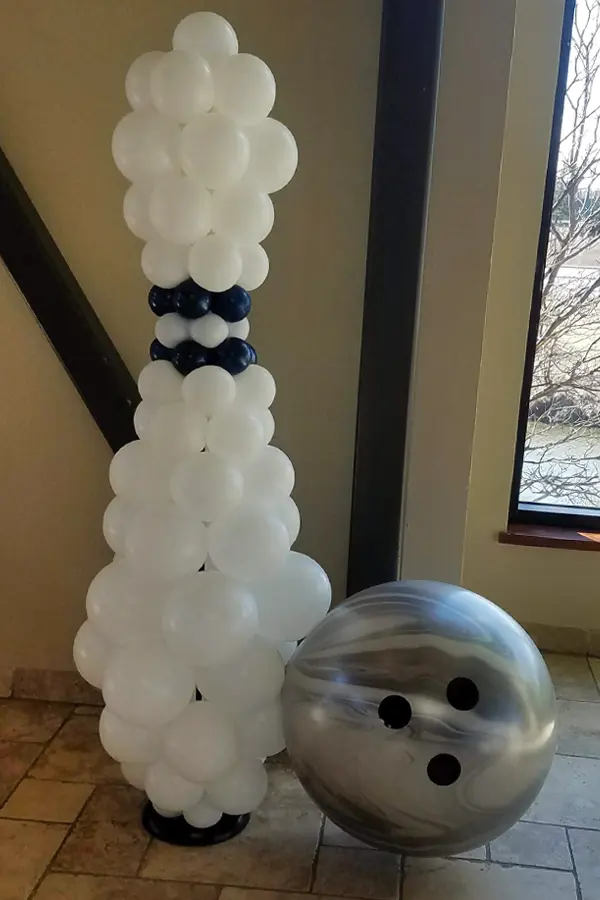 Bowling pin with bowling ball balloon sculpture