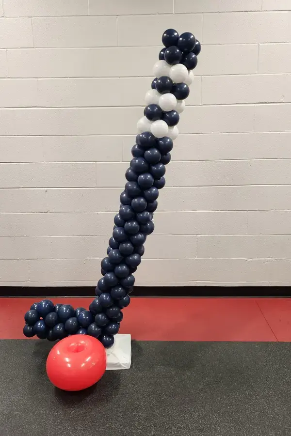 Hockey stick and puck balloon sculpture