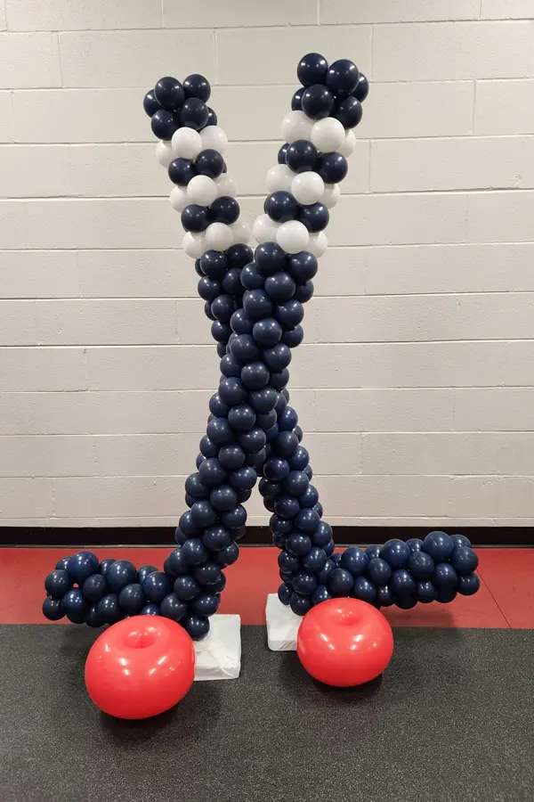Hockey stick and puck balloon sculpture
