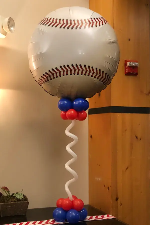 Table centerpiece with jumbo sport ball balloon foil