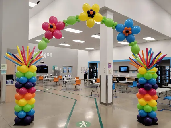 Indoor balloon arch with helium flowers