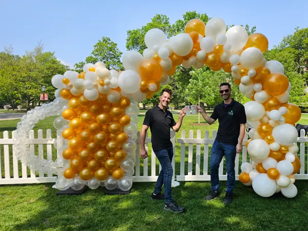 A festive alternative to a classic balloon arch, cheers