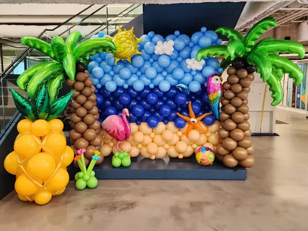 Stunning tropical themed photo backdrop and balloon display