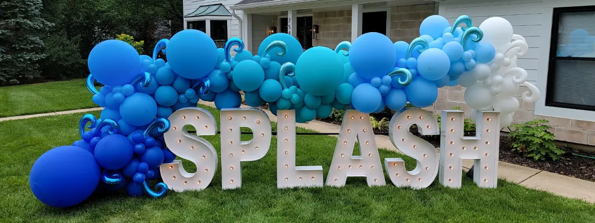 Organic balloon garland in blues on Alpha-Lit lettering