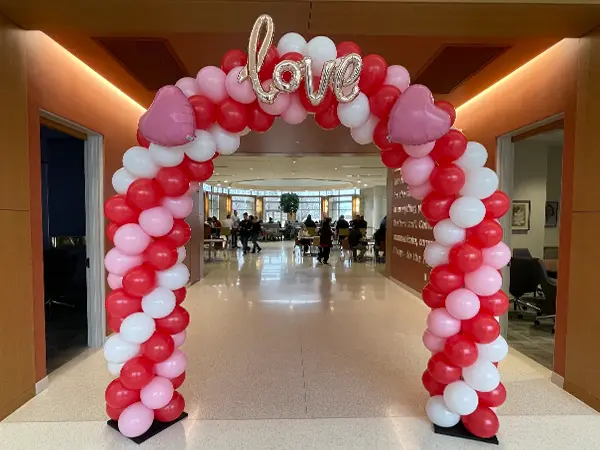 Classic balloon arch with foil love letter accents