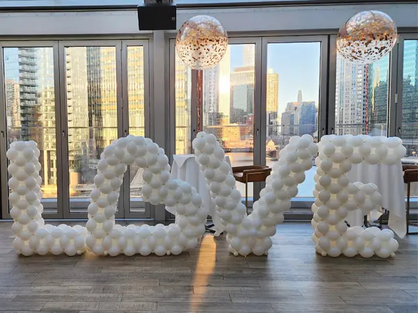 Latex balloon letter sculpture spelling out LOVE