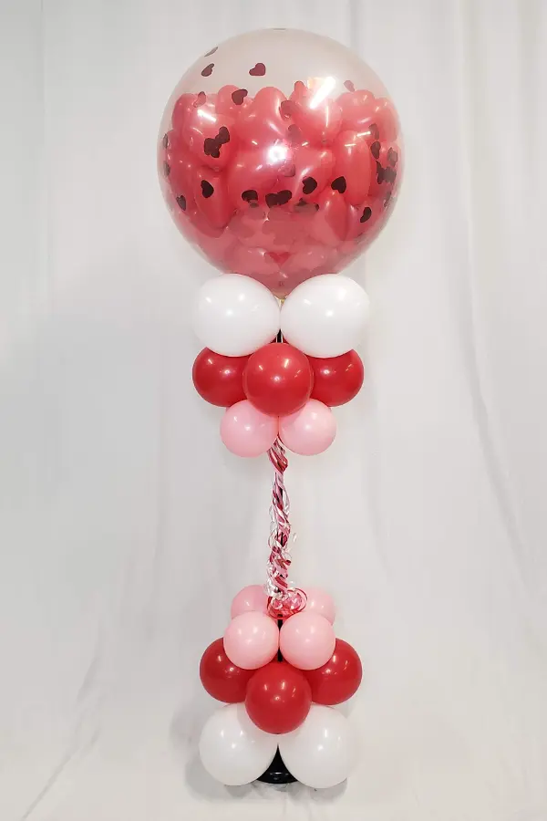 Standing pop column filled with mini heart balloons